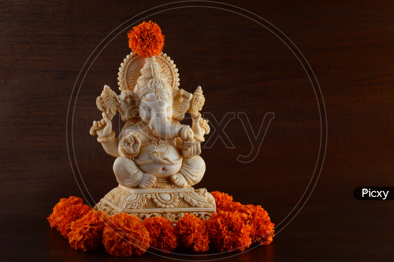Lord Ganesha Idols decorated with MariGold flowers