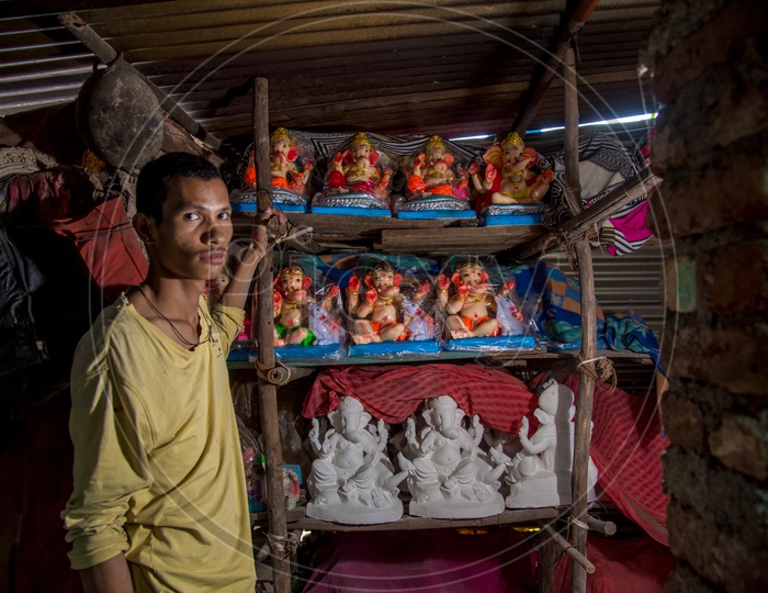 An Artist With The Ganesh Idols In a  Workshop