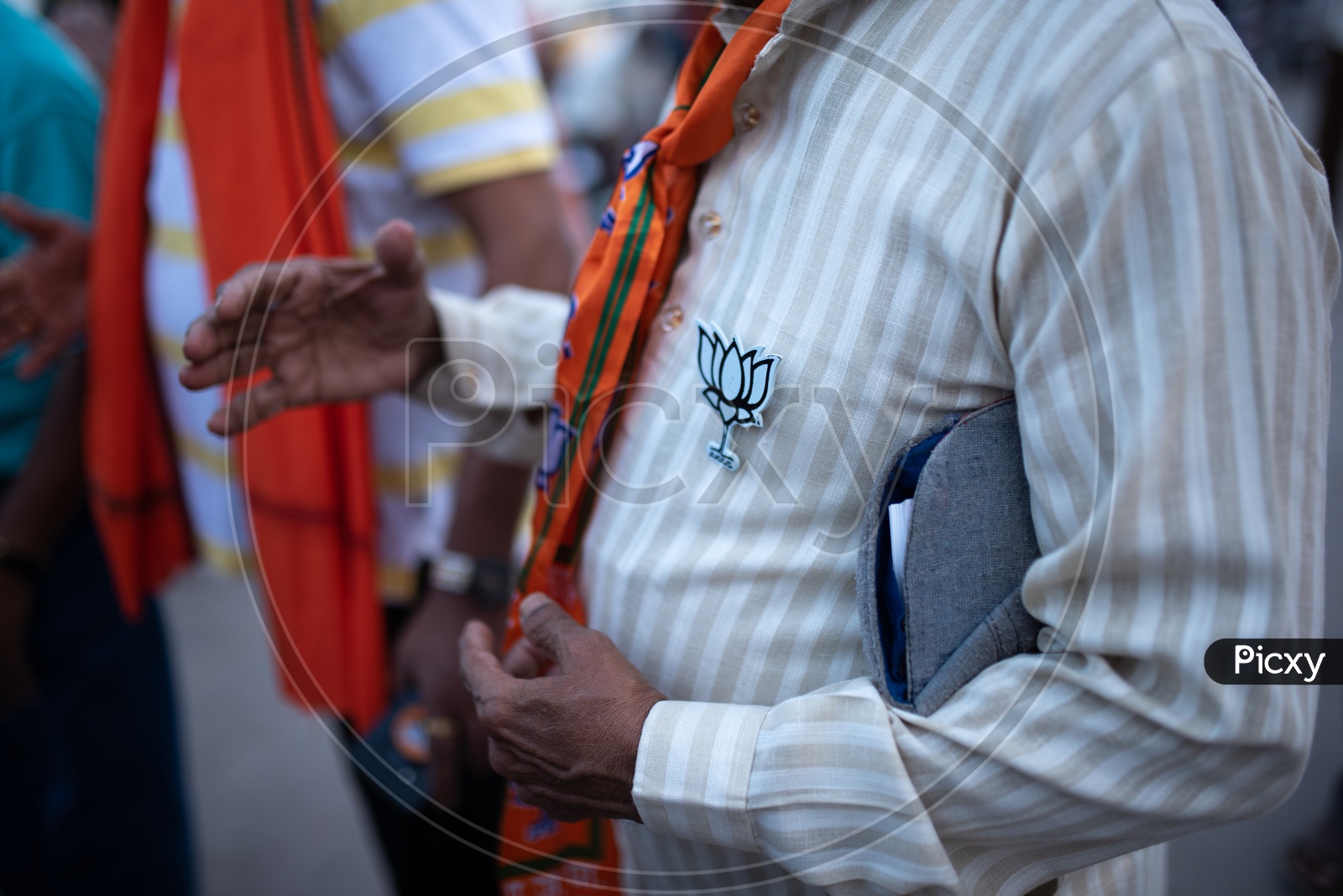 BJP Party Supporter Or Party Workers Wearing Party Symbol Tags  to Shirt  As a  Part Of Election Campaign