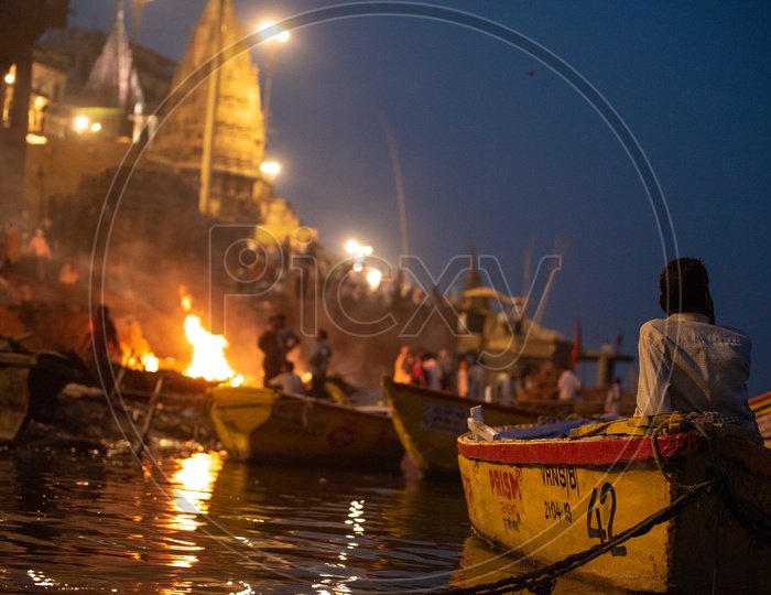 A Boat Rider Or Helmsman  At Manikarnika Ghat In Varanasi