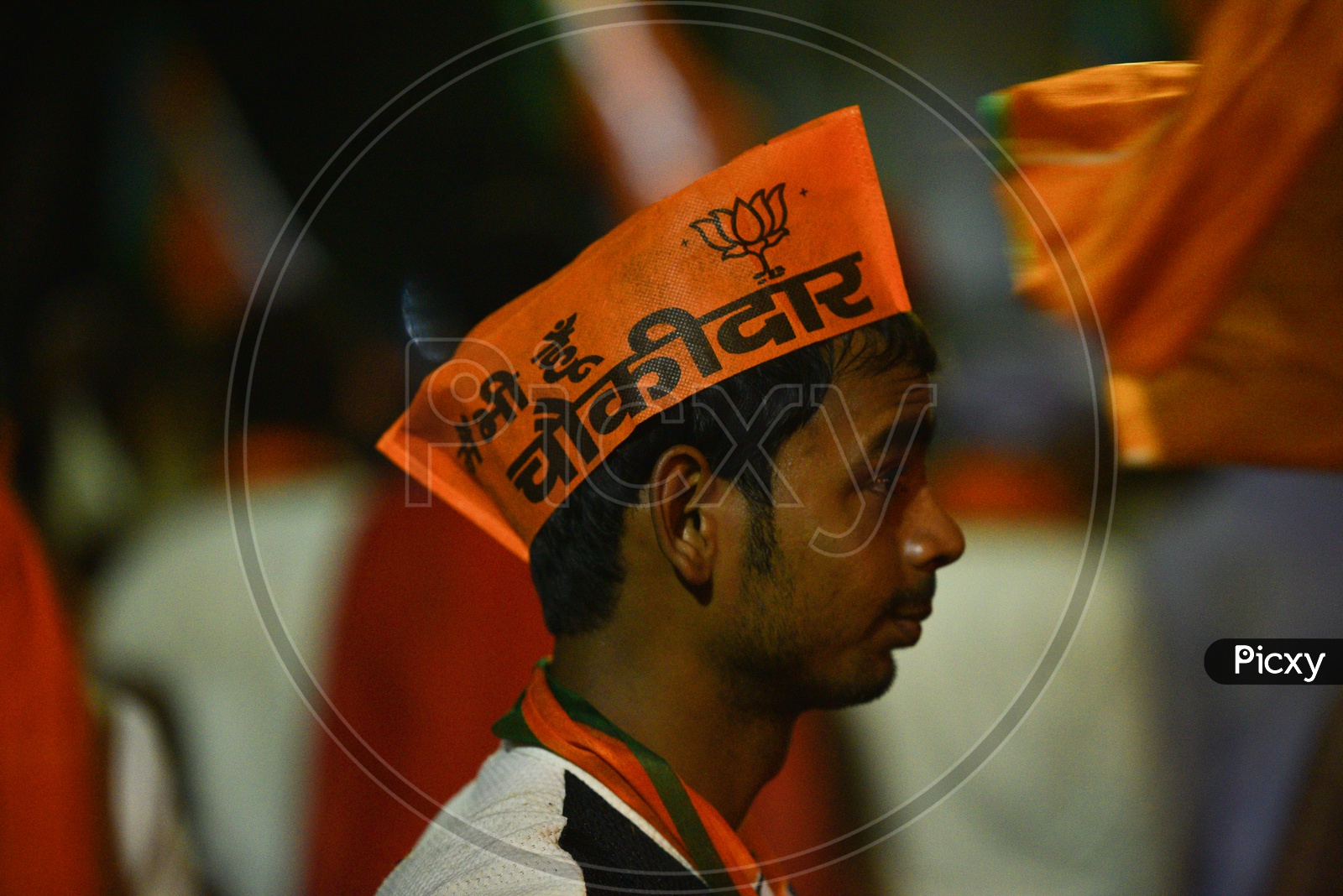 BJP Party Supporters Wearing The Party Caps At Election Campaign Rallies  Or At Party Meeting