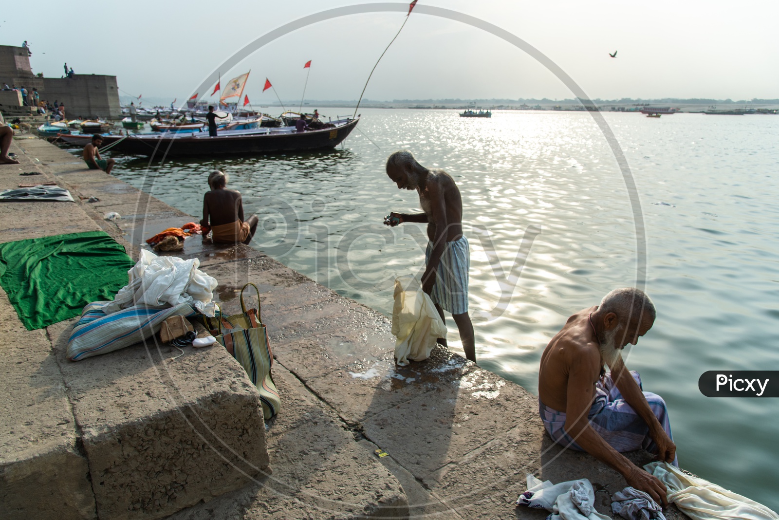 Pilgrims  Washing Clothes On The Ganga River Ghats In Varanasi