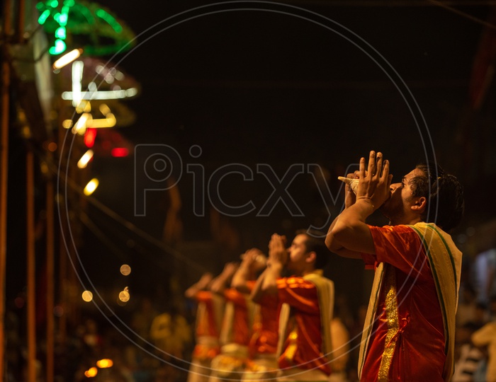 Priests Performing Ganga Aarti Or Ganga Haarati   For Sacred River Ganga  in Varanasi