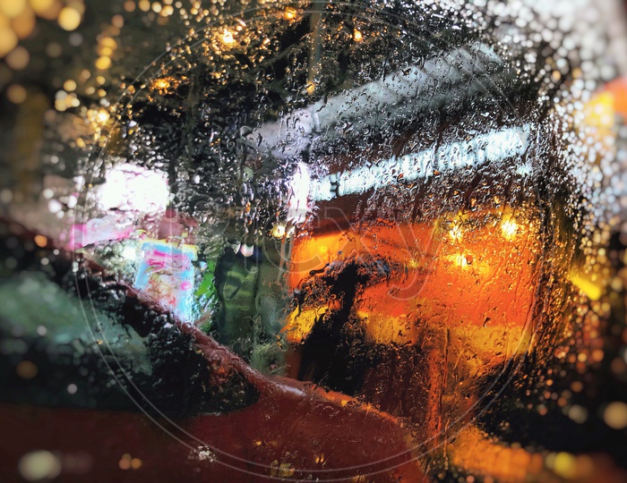Patterns Of Water Droplets On a Car Window Glass