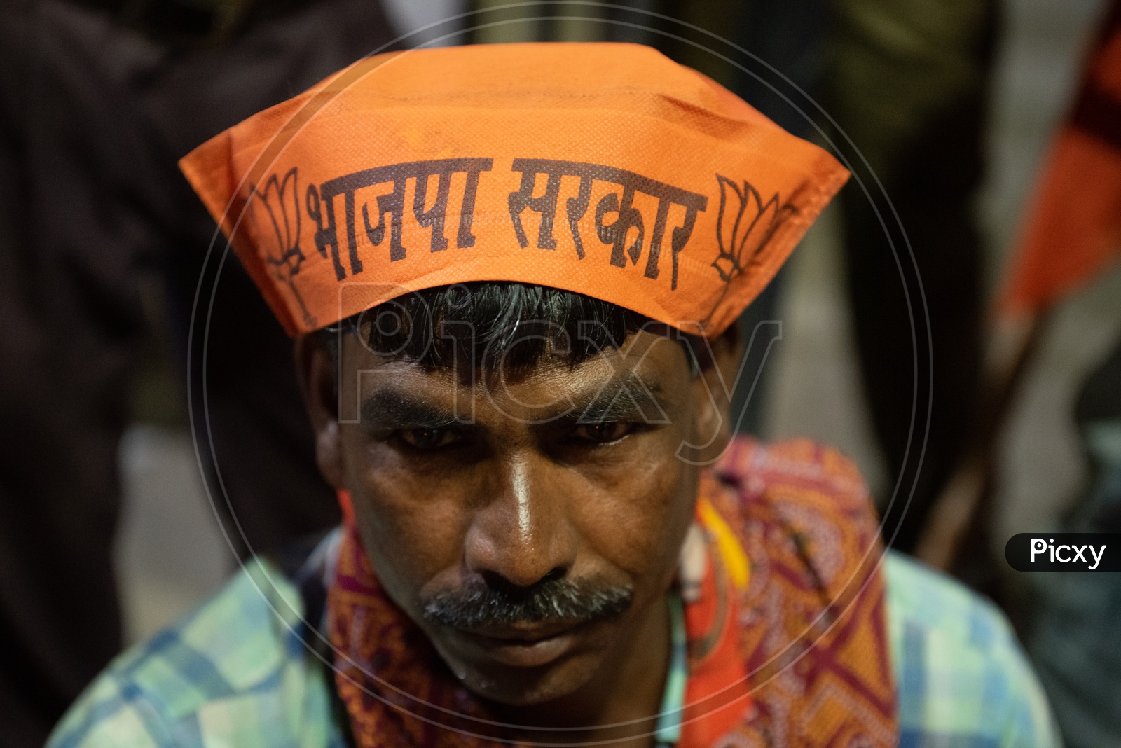 BJP Party Workers Or Supporters Wearing the BJP Caps During Election Campaign Rallies or Party Meetings