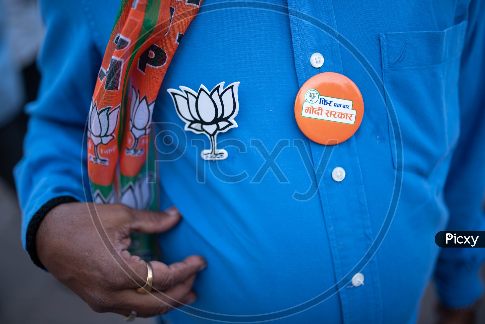 BJP Party Supporter Or Party Workers Wearing Party Symbol Tags  to Shirt  As a  Part Of Election Campaign