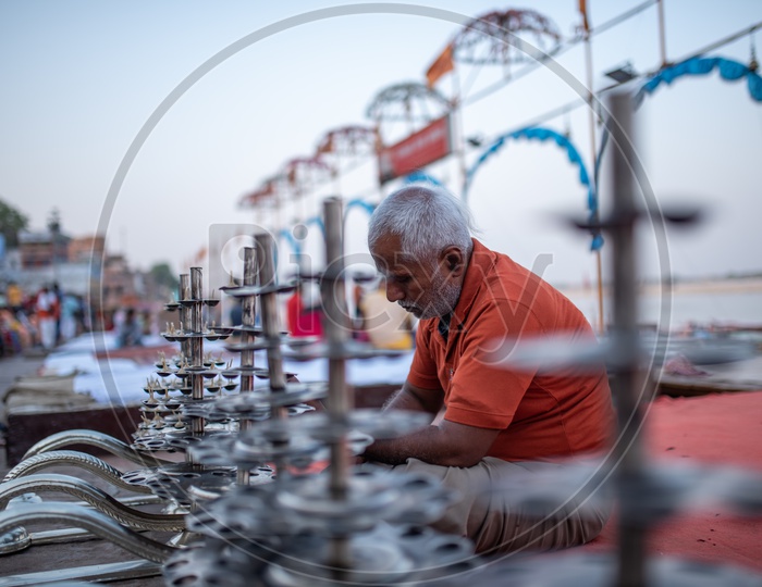 A Man Preparing  Ganga Aarti  With Edible Oil and Cotton Buds  at The Ghats Of  Varanasi