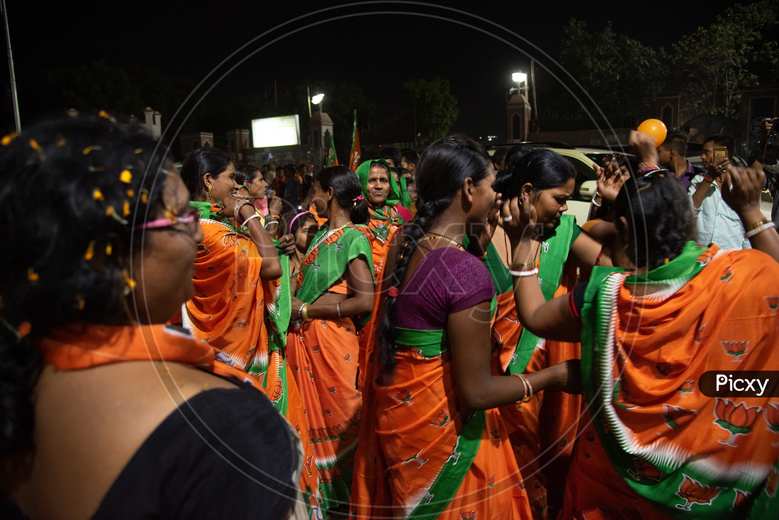 BJP Party Workers Or Supporters  or Karyakathas  Wearing The BJP Saris Or Sarees  During The Election Campaign Or  Party meetings