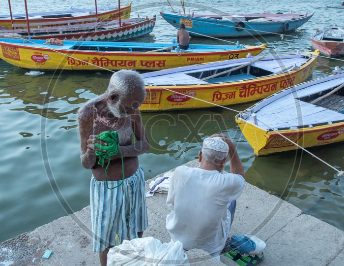 A Muslim Old Man  An a Hindu Devotee  On the Bank Of River Ganga At Ghats Of Varanasi