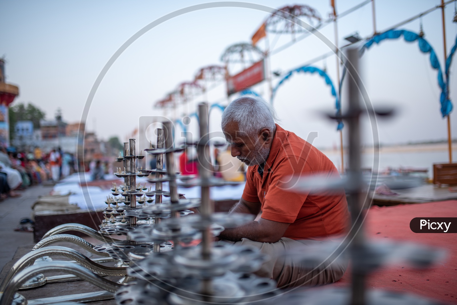 A Man Preparing  Ganga Aarti  With Edible Oil and Cotton Buds  at The Ghats Of  Varanasi