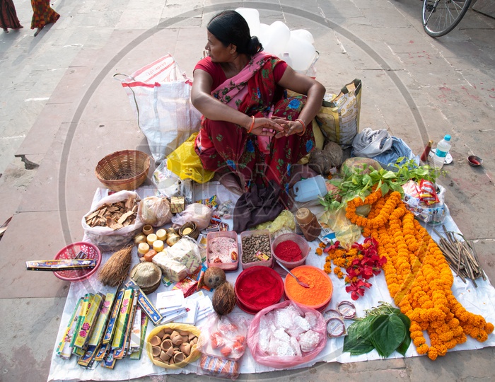 A Woman Vendor Selling The Pooja Materials At  Ganga River Bank  at  Gandhi Ghat  in Patna