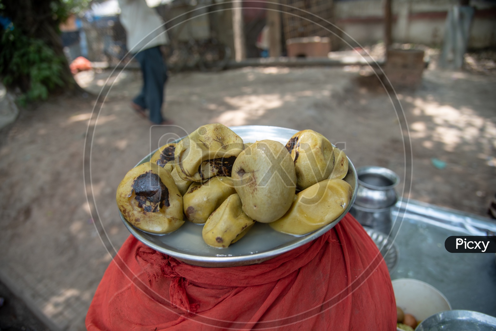 A Street Food Vendor Making Aam Panna Or Green Mango Juice  at a Vendor Stall