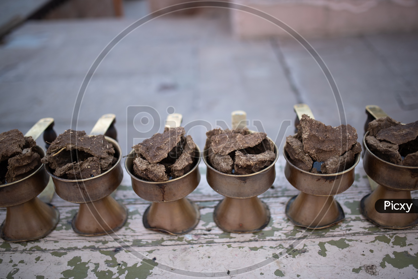 Ganga Aarti  Brass Plates  Filled With Camphor And Dried Cow Dung Cakes  in Varanasi