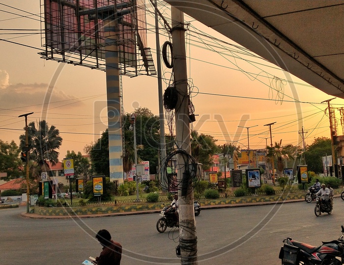 A wide angle view of kotireddy circle junction at evening time during sunset