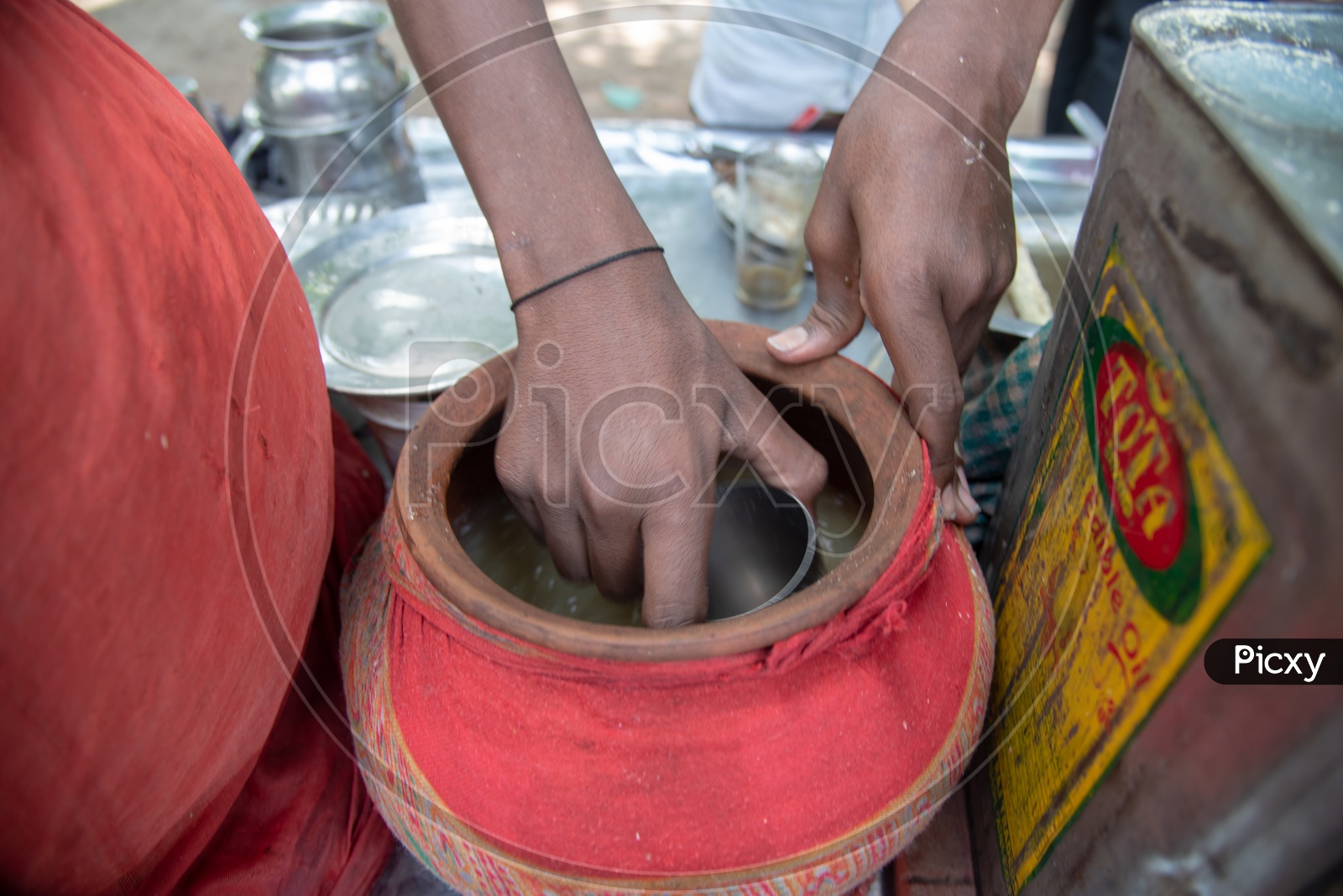 A Street Food Vendor Making Aam Panna Or Green Mango Juice  at a Vendor Stall
