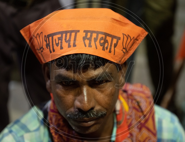 BJP Party Workers Or Supporters Wearing the BJP Caps During Election Campaign Rallies or Party Meetings
