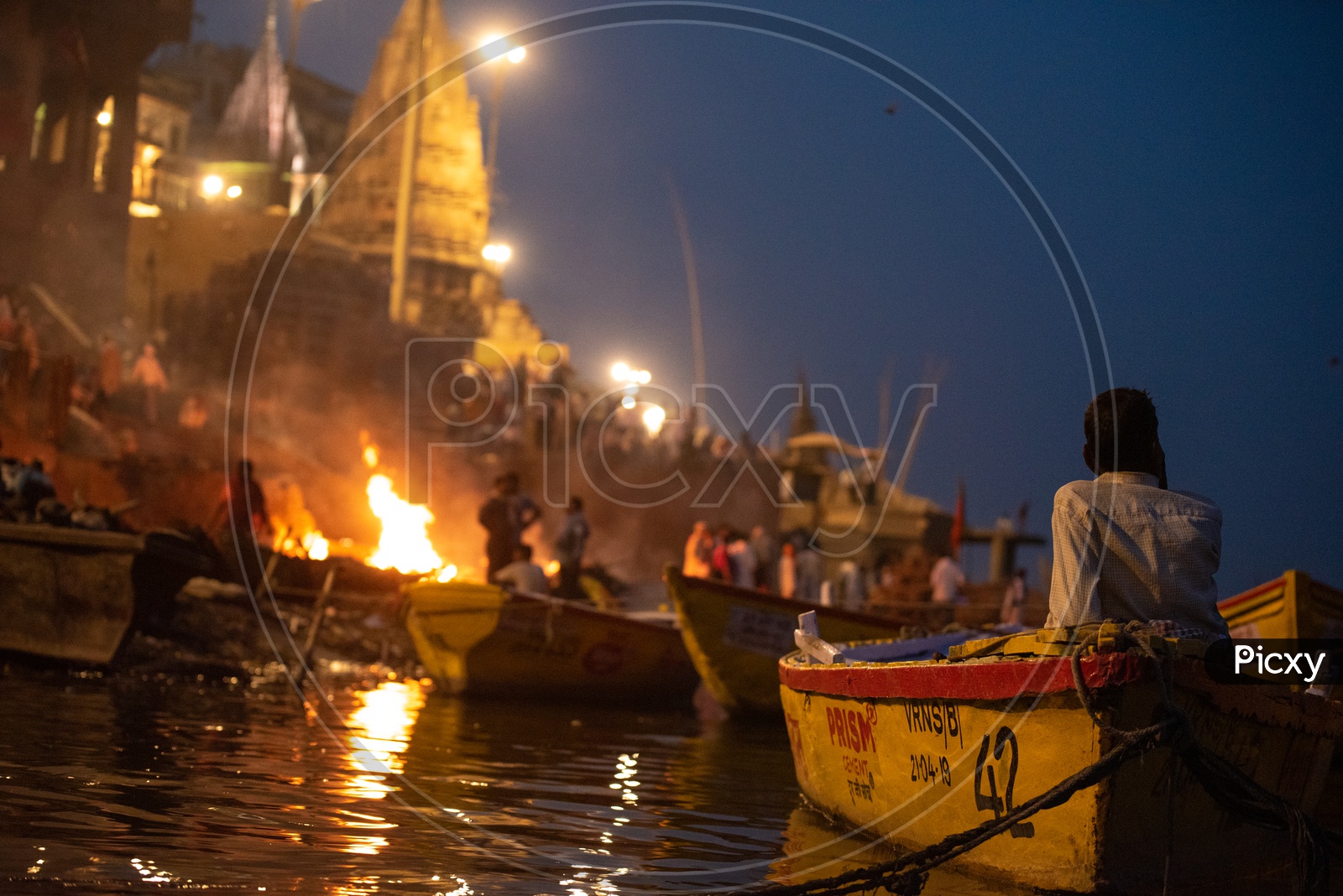 A Boat Rider Or Helmsman  At Manikarnika Ghat In Varanasi