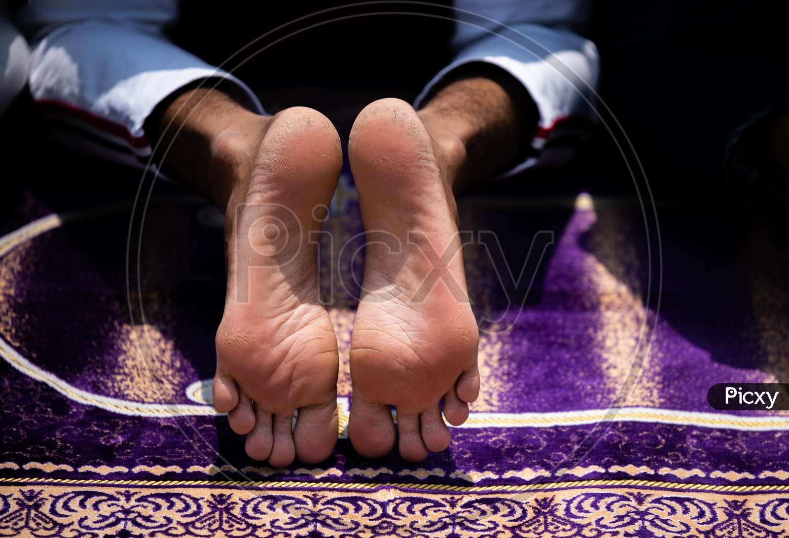 A Muslim  Man  Doing Namaz or Prayer Leg Closeup
