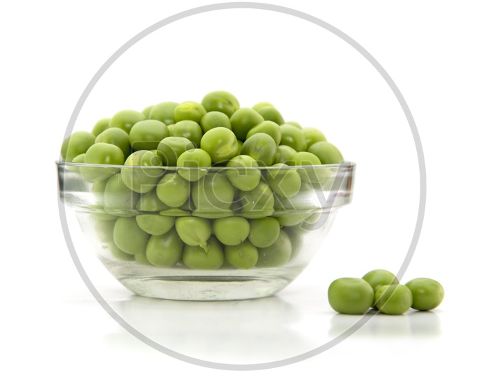 Fresh Green Peas In A Bowl On an Isolated White Background