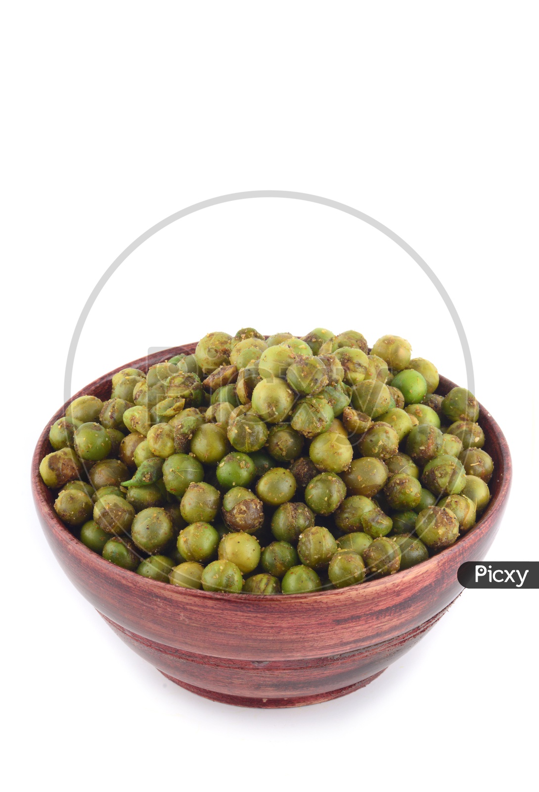 Image of Indian Salty Deep Fried Green Peas In a Wooden Bowl On an Isolated White Background