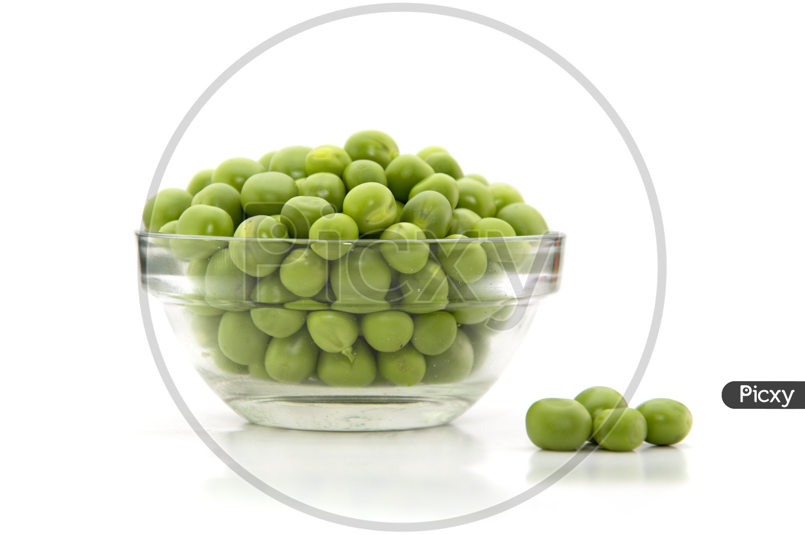 Fresh Green Peas In A Bowl On an Isolated White Background