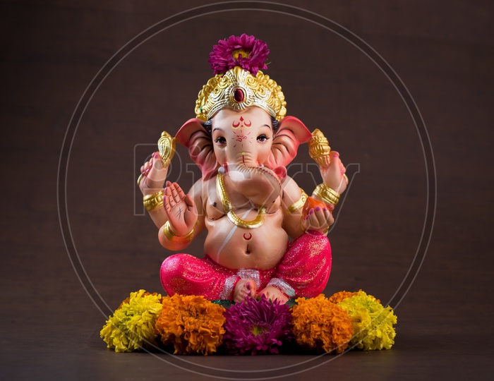 Indian Hindu God, Lord Ganesh Idol For  Pooja For Ganesh Chathurdhi  On an Isolated Black Background