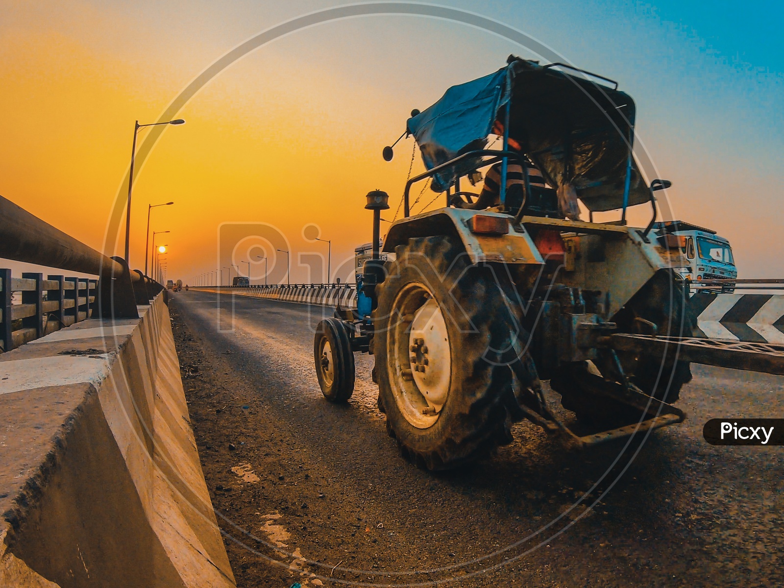 Tractor moving along the bridge