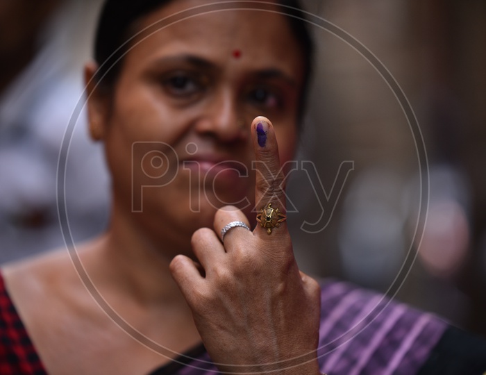 Indian Woman Showing Inked Finger After Casting Her Vote In Lok Sabha  General Elections 2019 in West Bengal