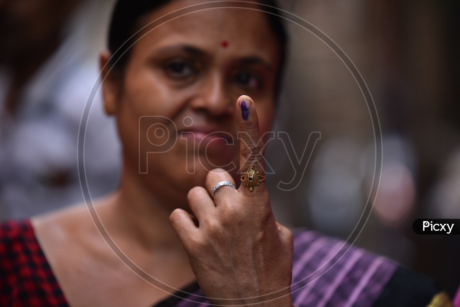 Indian Woman Showing Inked Finger After Casting Her Vote In Lok Sabha  General Elections 2019 in West Bengal