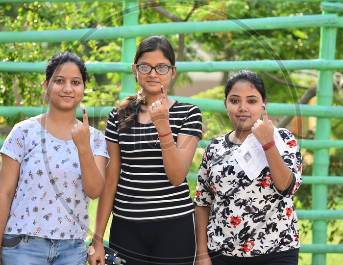 A Young Indian Girls  Showing Inked Finger After Casting their  Vote in General Elections 2019 in West Bengal