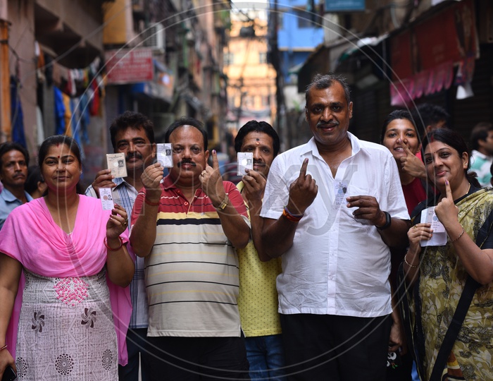 Voters Showing Their Inked Fingers And Voter ID or EPIC Voter Cards After Casting Their Votes  In  General Elections 2019  in West Bengal