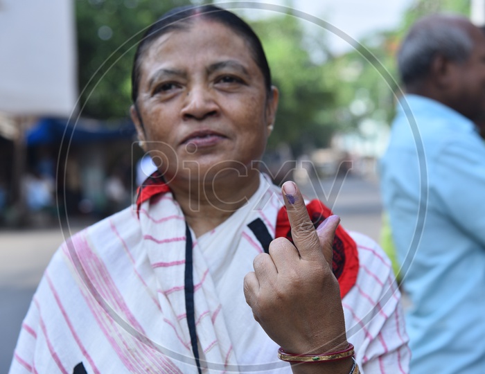 An Indian Woman Showing Inked Finger After Casting Her Vote In Lok Sabha  General Election  2019  in West Bengal