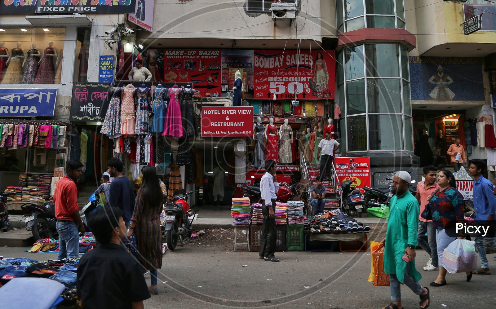 A Busy Fancy Bazaar With Clothes Stores And  Shoppers