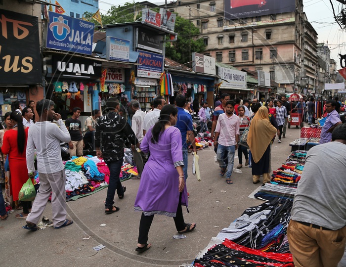 A Busy Street With Stalls  And Shoppers  At Fancy Bazaar in Guwahati
