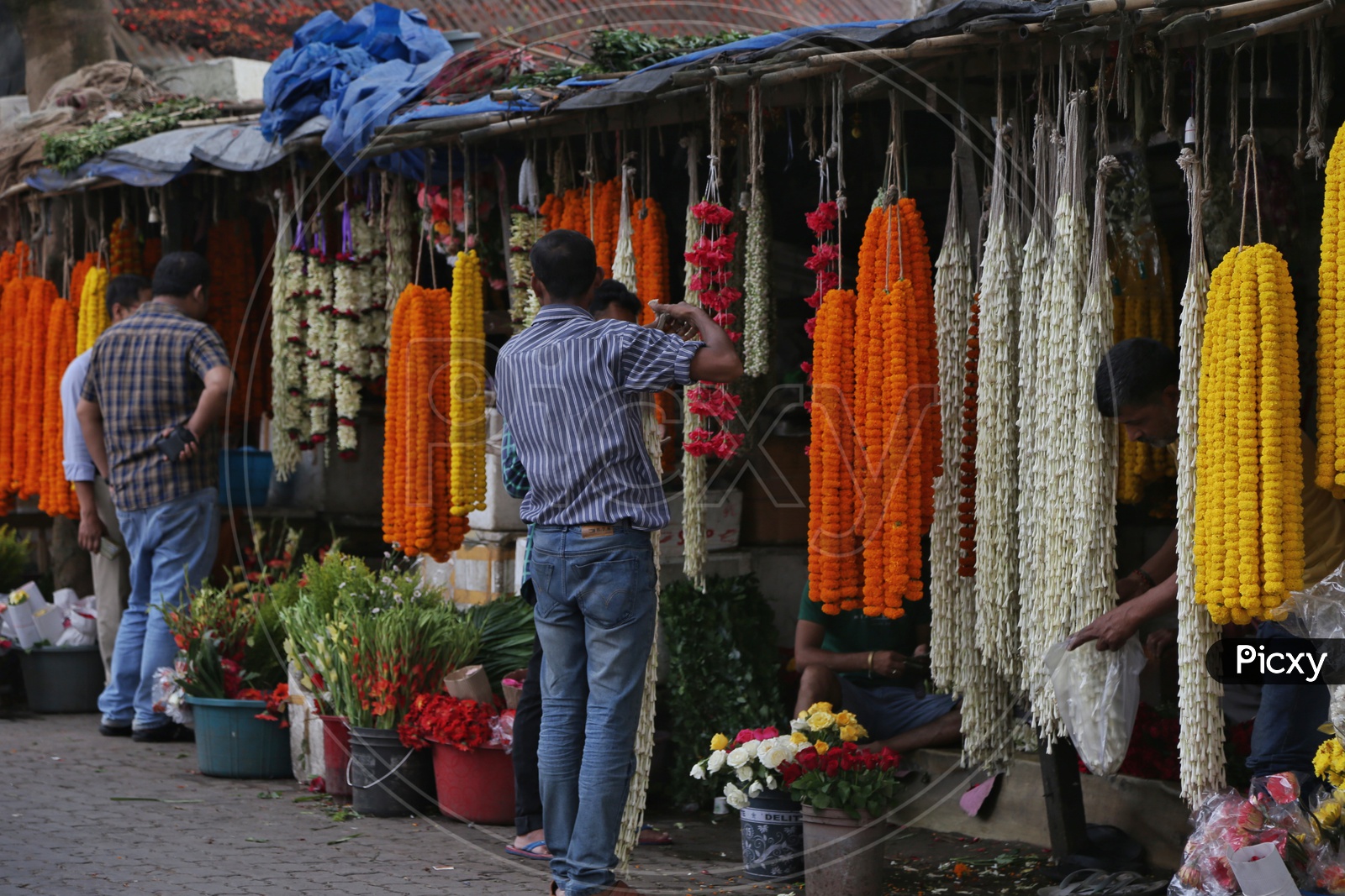Garlands With  Fresh Flowers  In The Vendor Stalls
