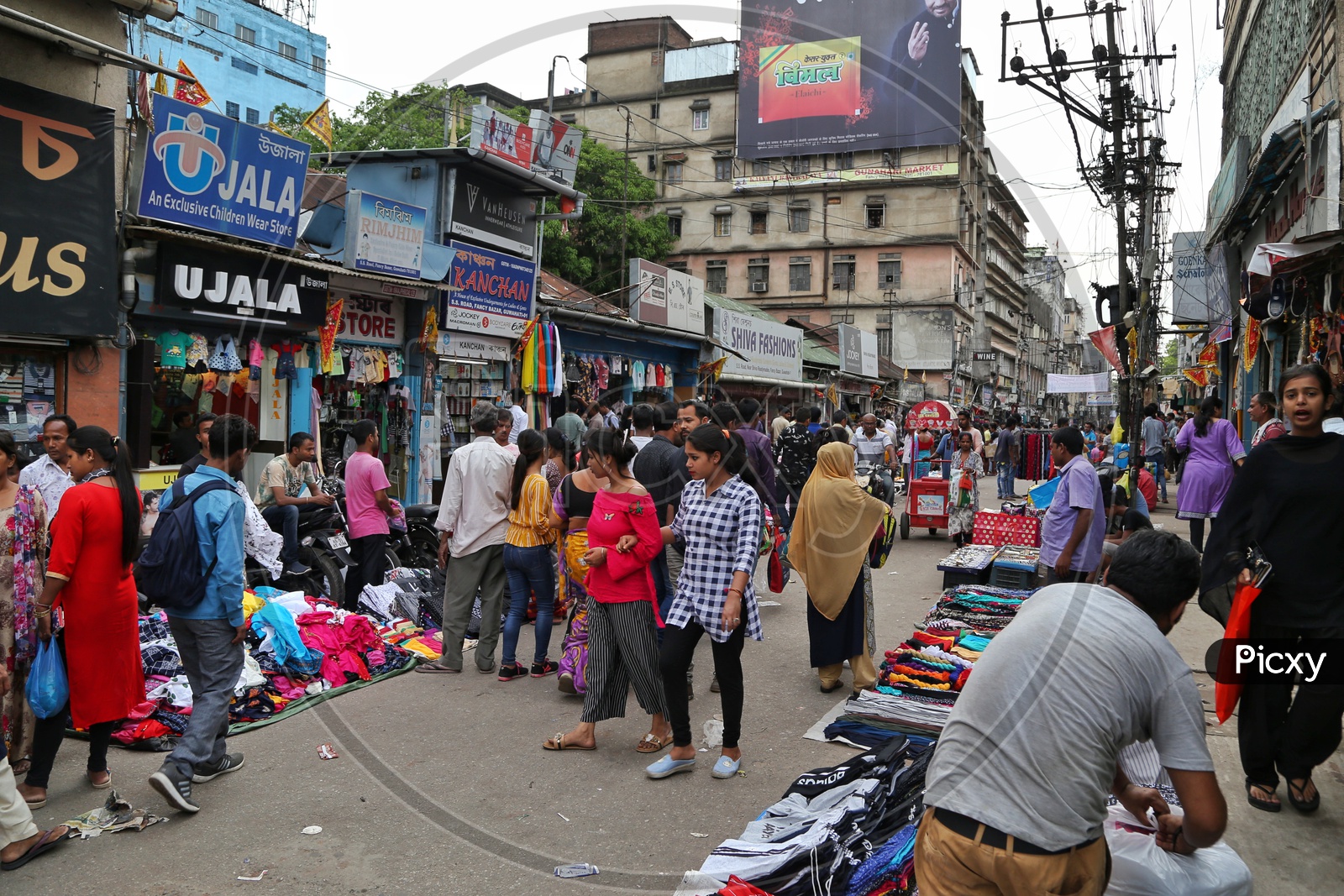 A Busy Street With Stalls  And Shoppers  At Fancy Bazaar in Guwahati