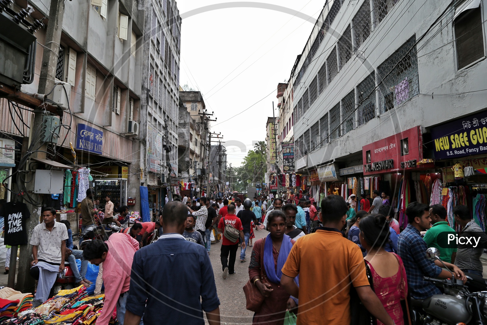 A Busy Fancy Bazaar With Clothes Stores And  Shoppers