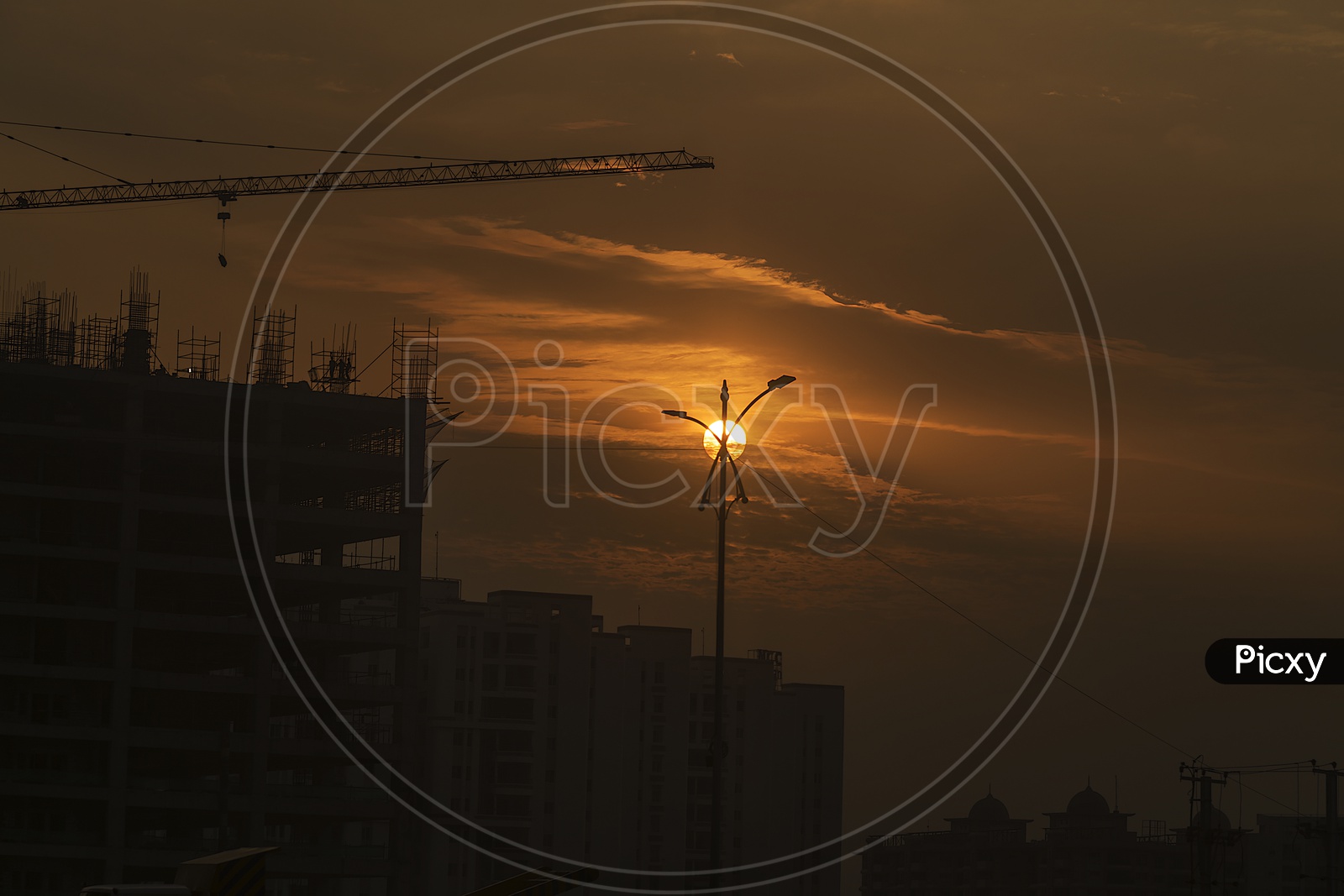 Sunset at construction site.