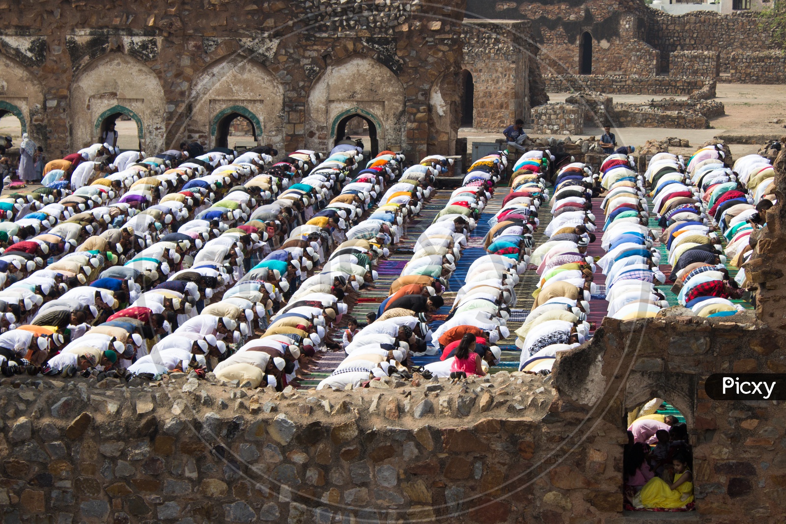 Muslims offering namaz prayer on Eid at Jami Masjid courtyard, Feroz Shah Kotla fort in Delhi