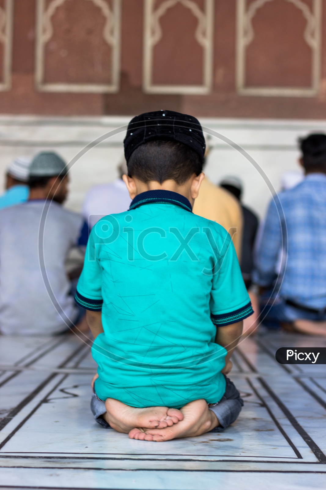 A little boy offering namaz prayer during Ramadan at Jama Masjid Delhi