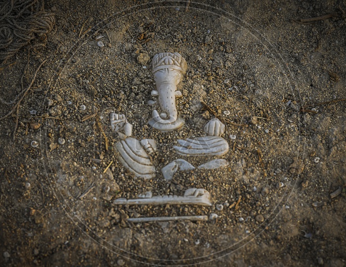 Ganesh Idol submerged in pathway