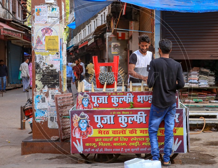 A man selling Kulfi in the streets of Haridwar