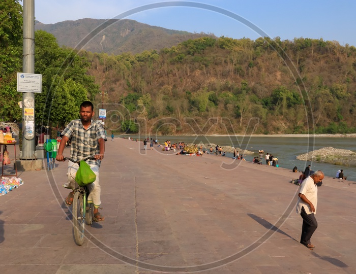 A man on a bicycle at Triveni ghat