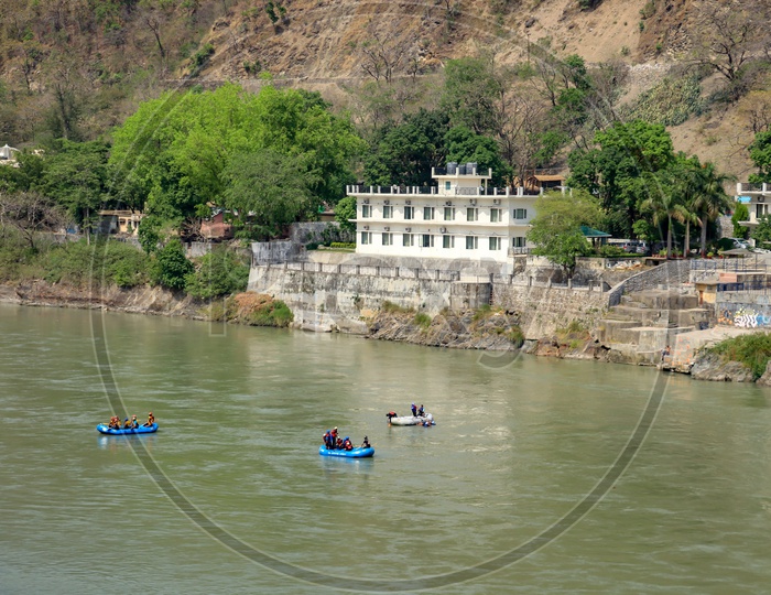 Tourists rafting across river Ganges in Rishikesh