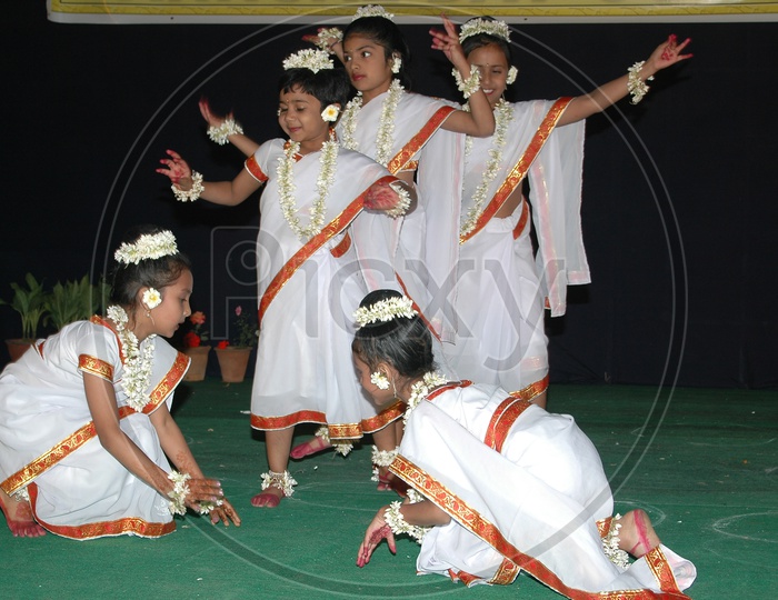 Children Performing on a Stage  In a Cultural Event  Or In  a Function or Annual Day  Concert  Wearing The Fancy  Dresses
