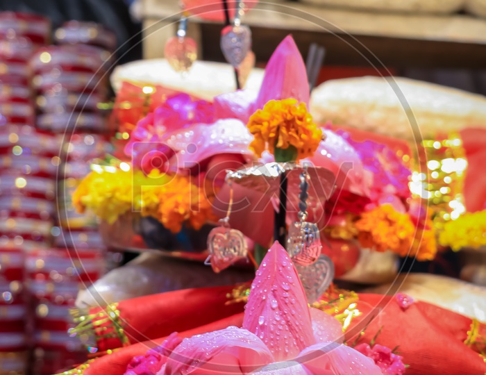 Fresh lotus and flowers being sold at a temple shop