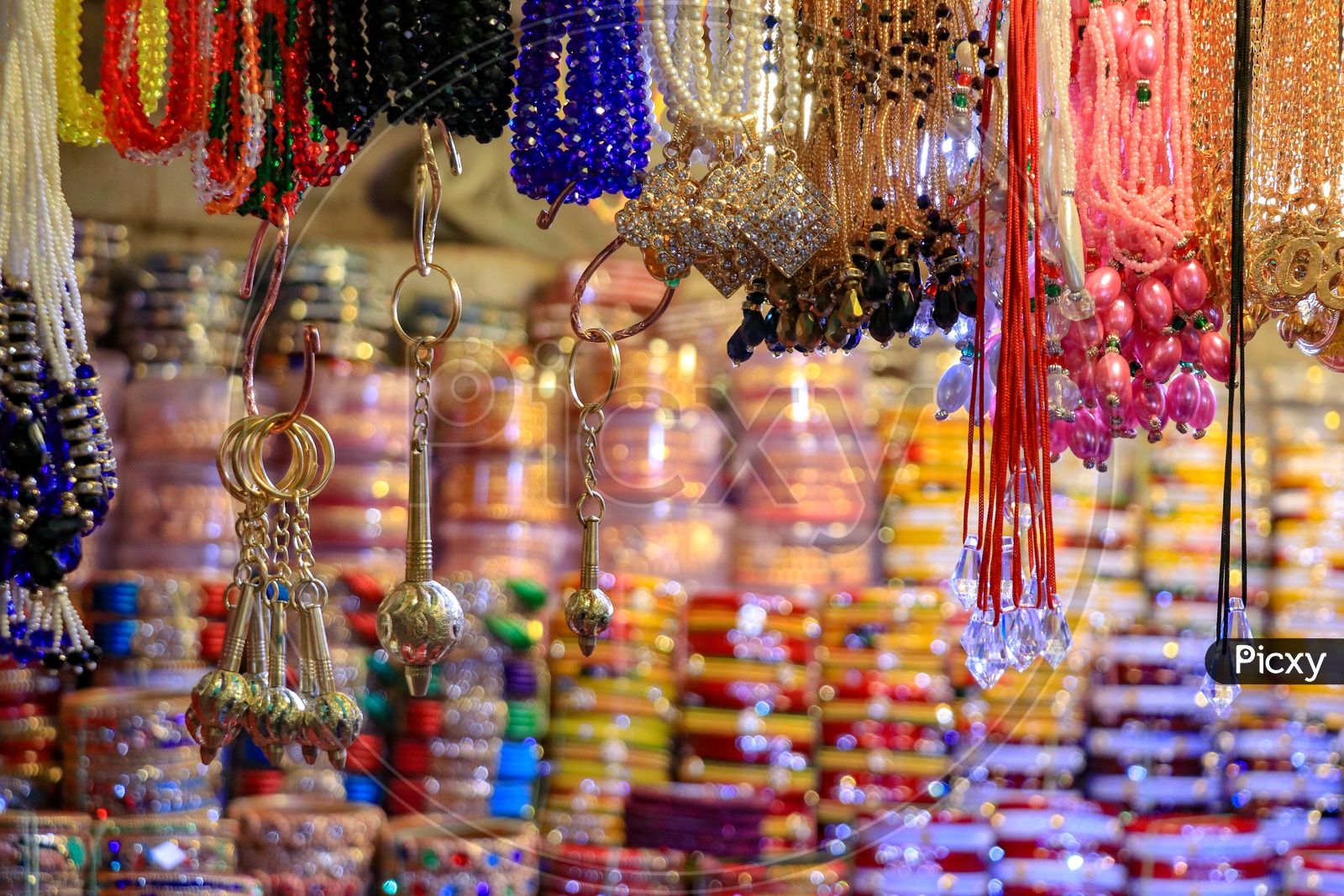 Display of colorful beaded chains and lockets