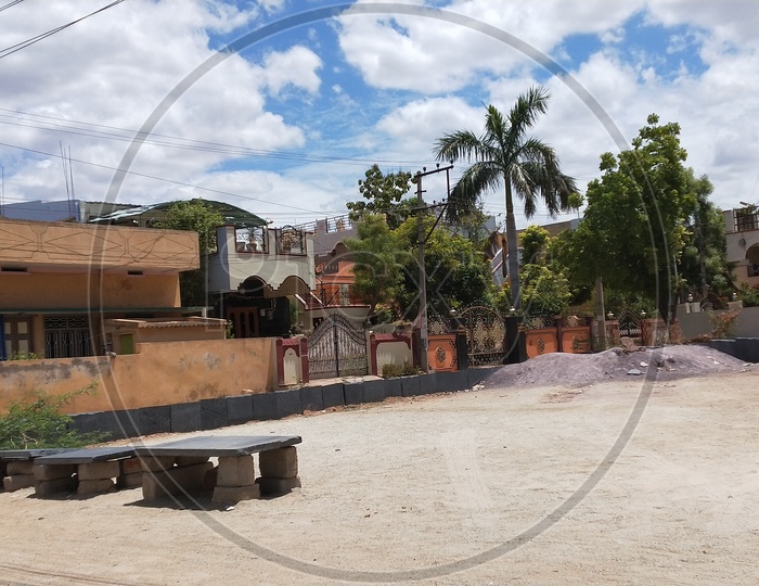 Empty playground with a background view of houses