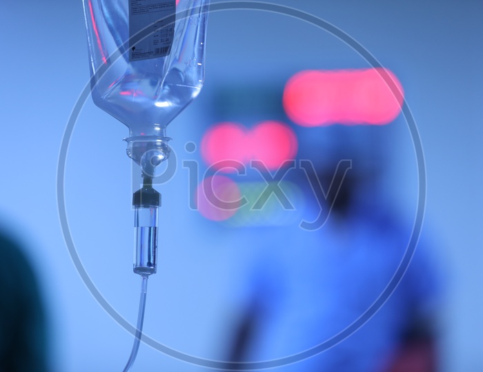 Saline Bottle or Pouch Hanging To a Stand in a  Hospital Ward