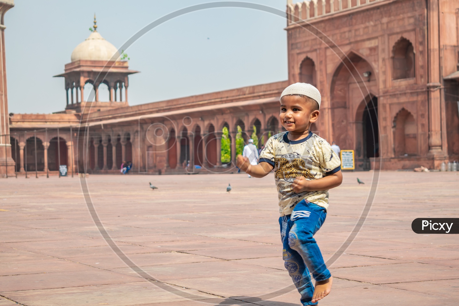 A child playing and enjoying on the day of Eid-ul-Fitr (End of the holy month of Ramadan) at Jama Masjid, Delhi